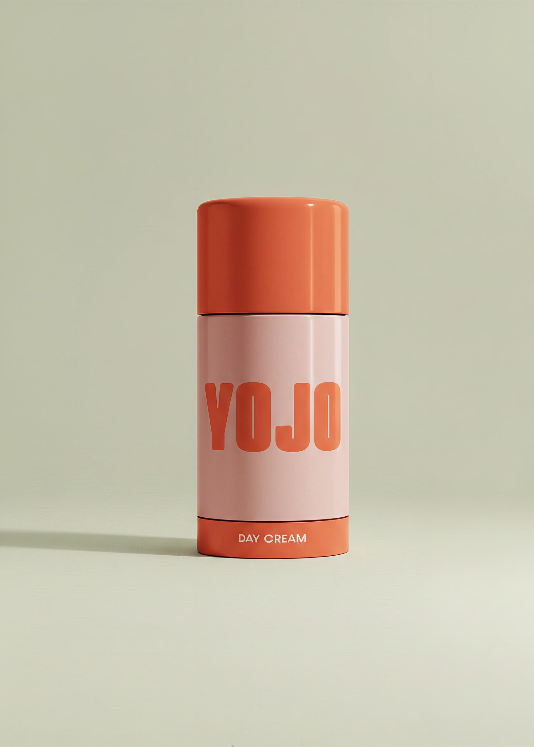 Cylindrical container labeled 'YOJO' with an orange lid on a light green background