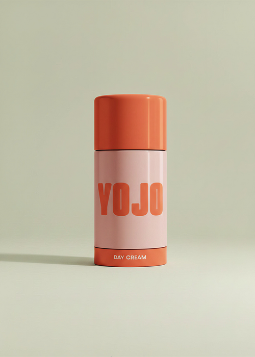 Cylindrical container labeled 'YOJO' with an orange lid on a light green background